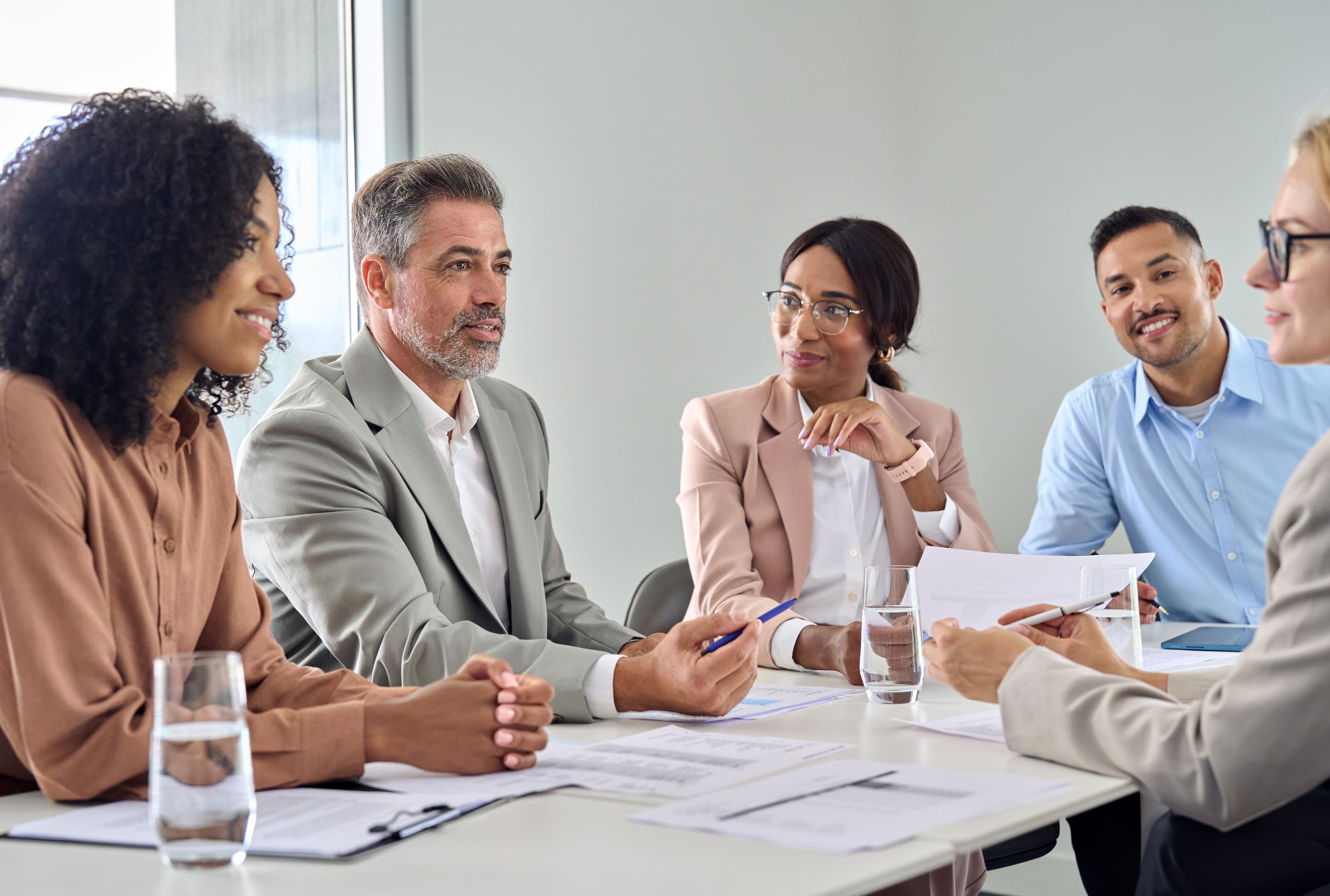 Management and supervision training preview. Group of managers talking together.